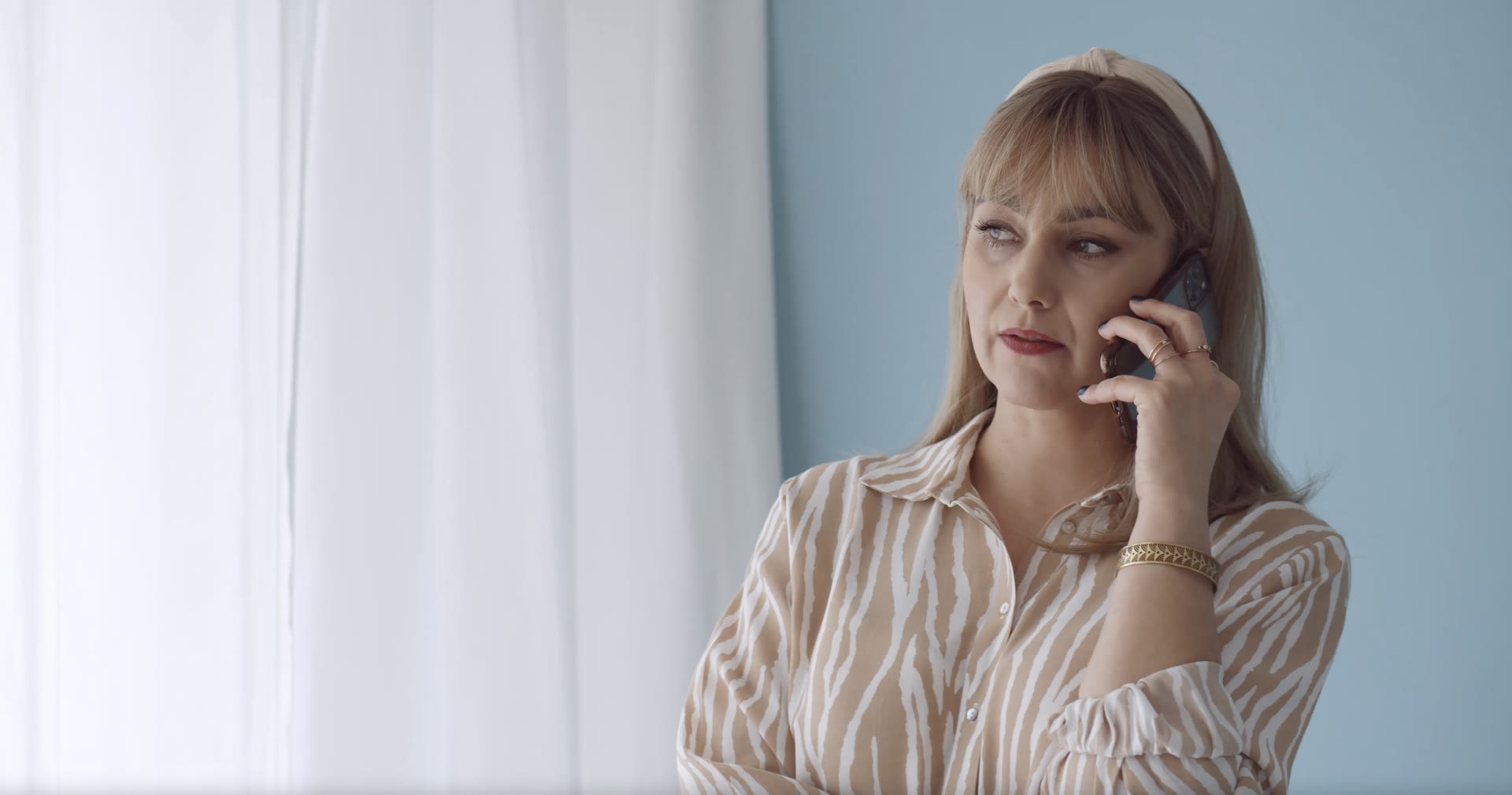A caller waiting on the phone for someone to answer